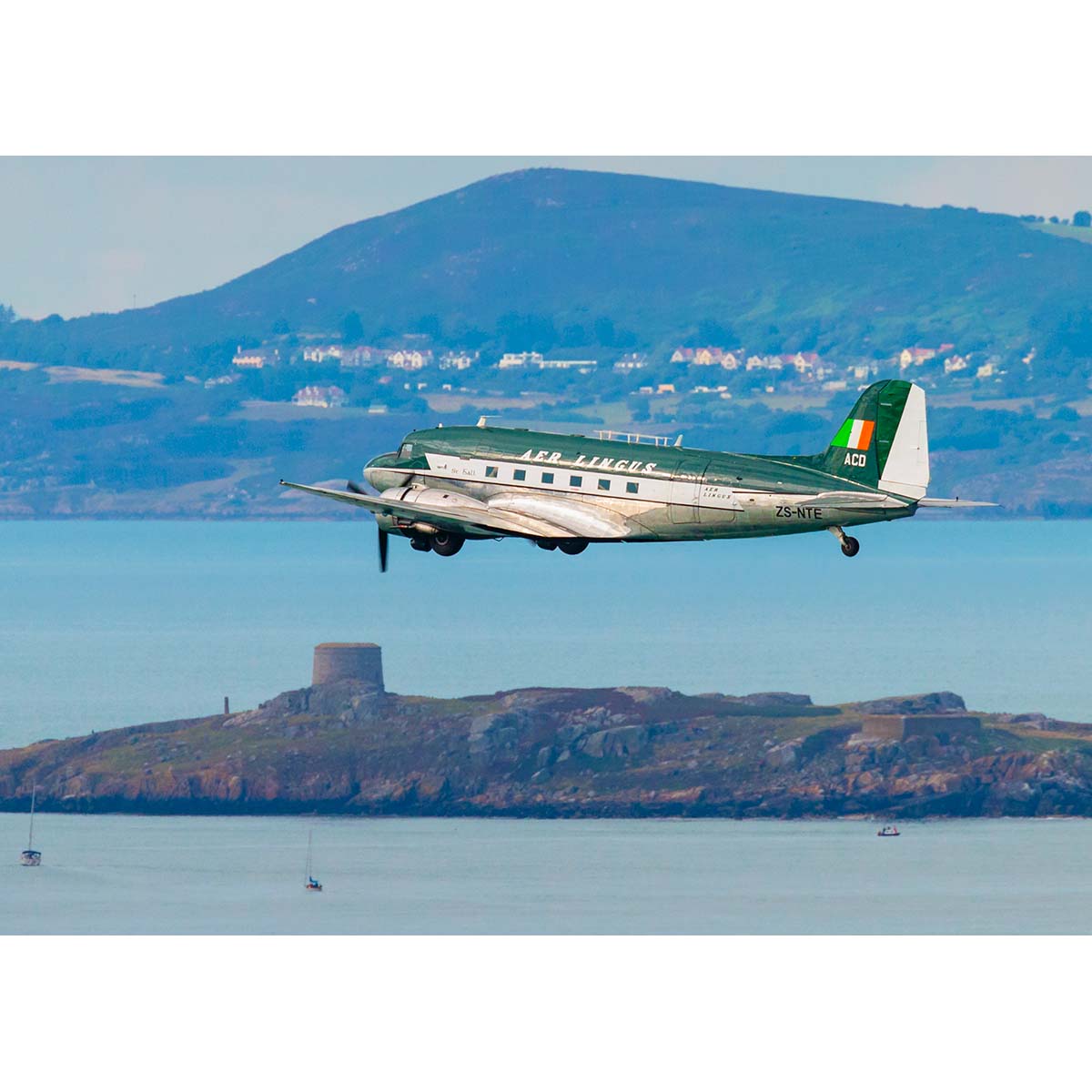 Douglas DC3 in Aer Lingus livery over Dalkey Island
